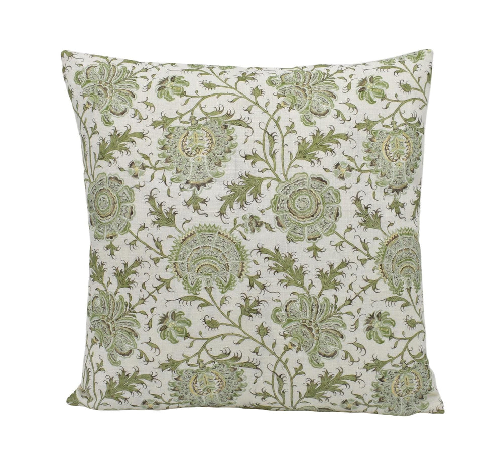 a green and white pillow on a white background