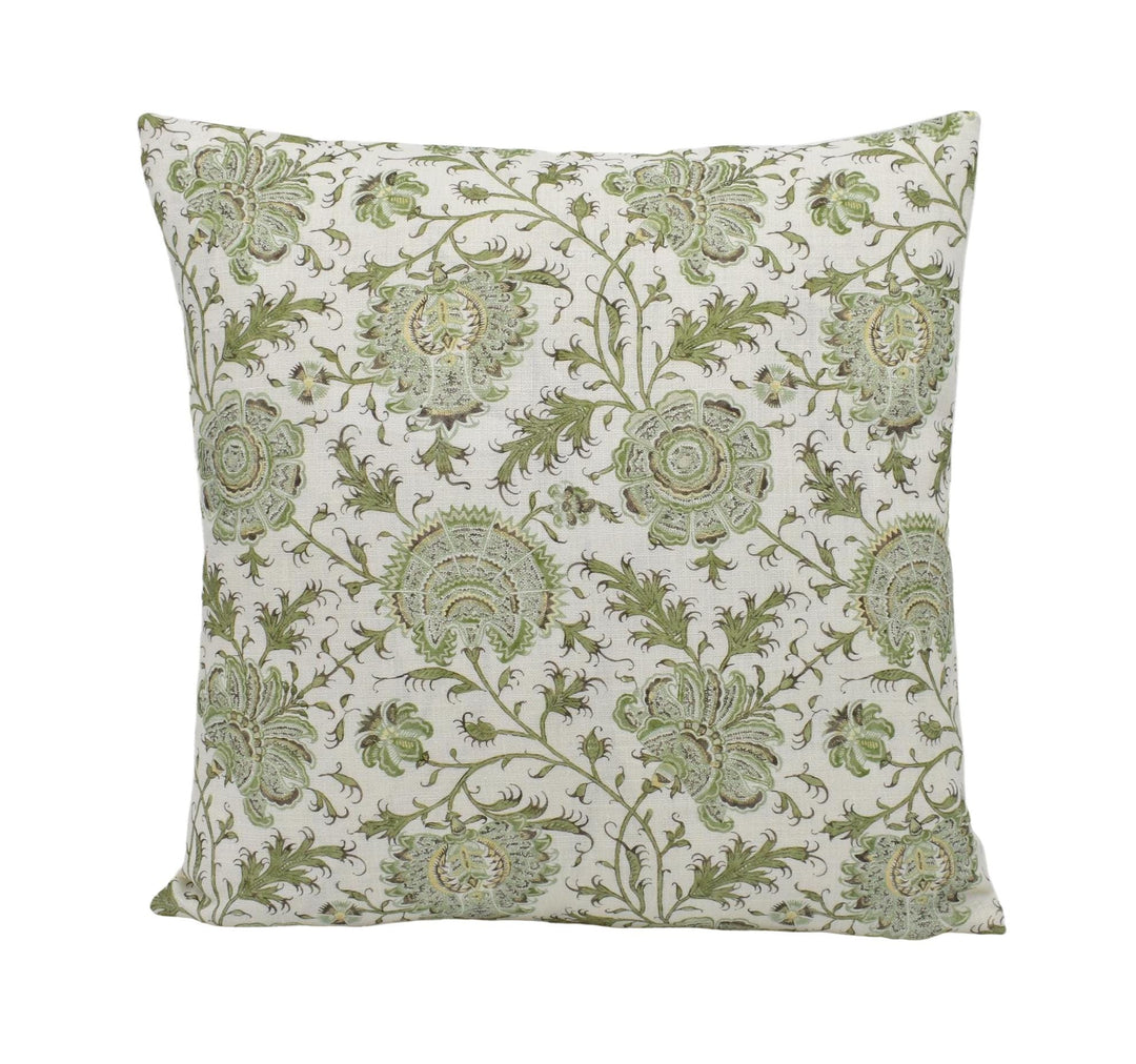 a green and white pillow on a white background