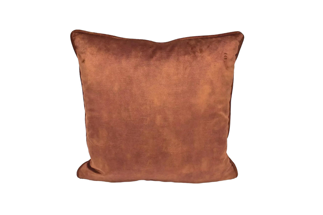A brown, plush pillow sits against a white background.