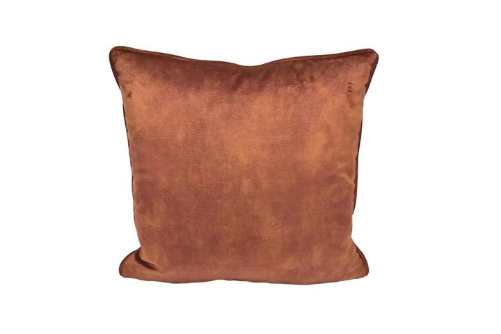 A brown, plush pillow sits against a white background.
