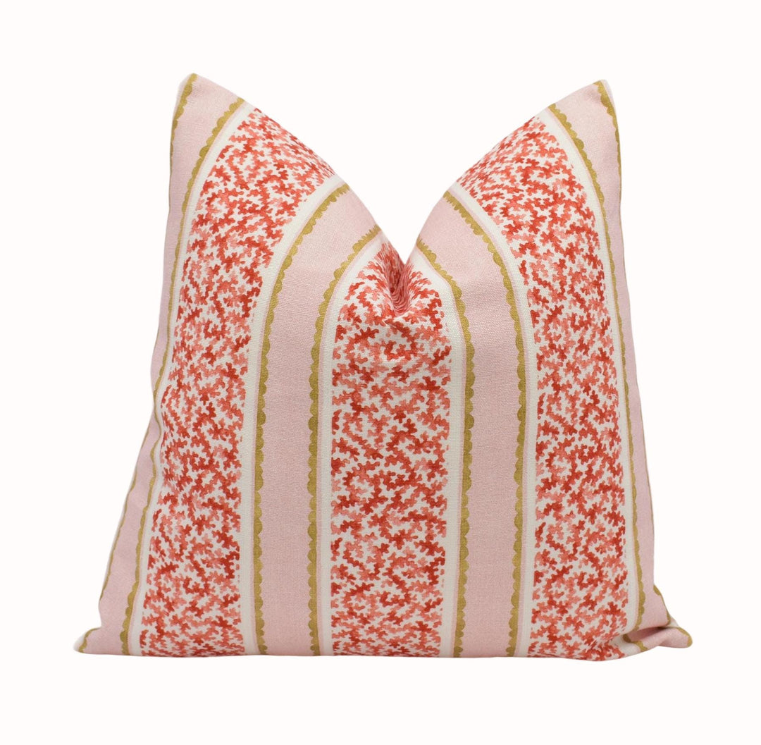 A single pillow with a floral pattern in shades of pink and red, featuring vertical stripes.