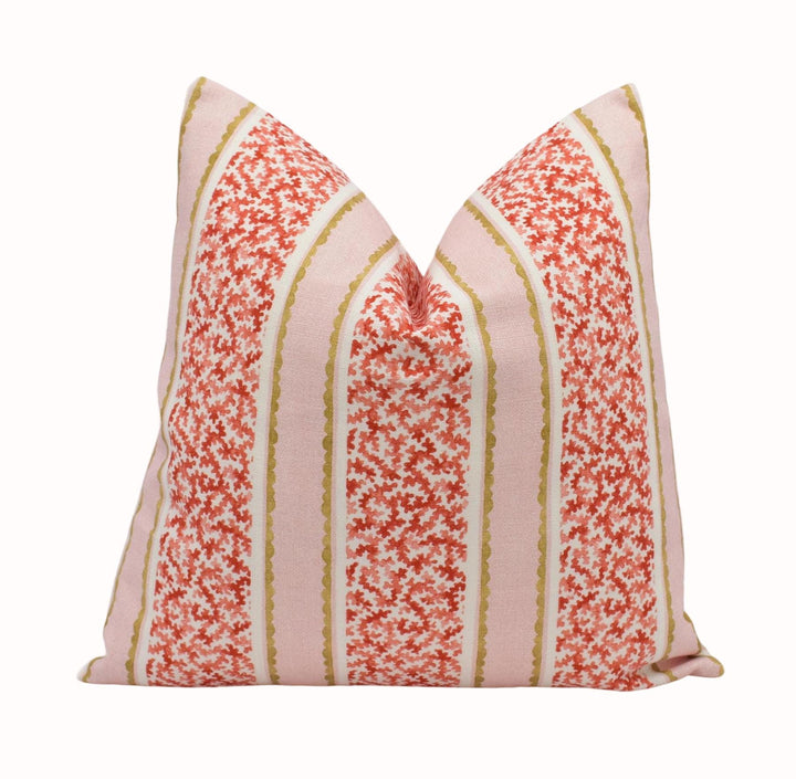 A single pillow with a floral pattern in shades of pink and red, featuring vertical stripes.
