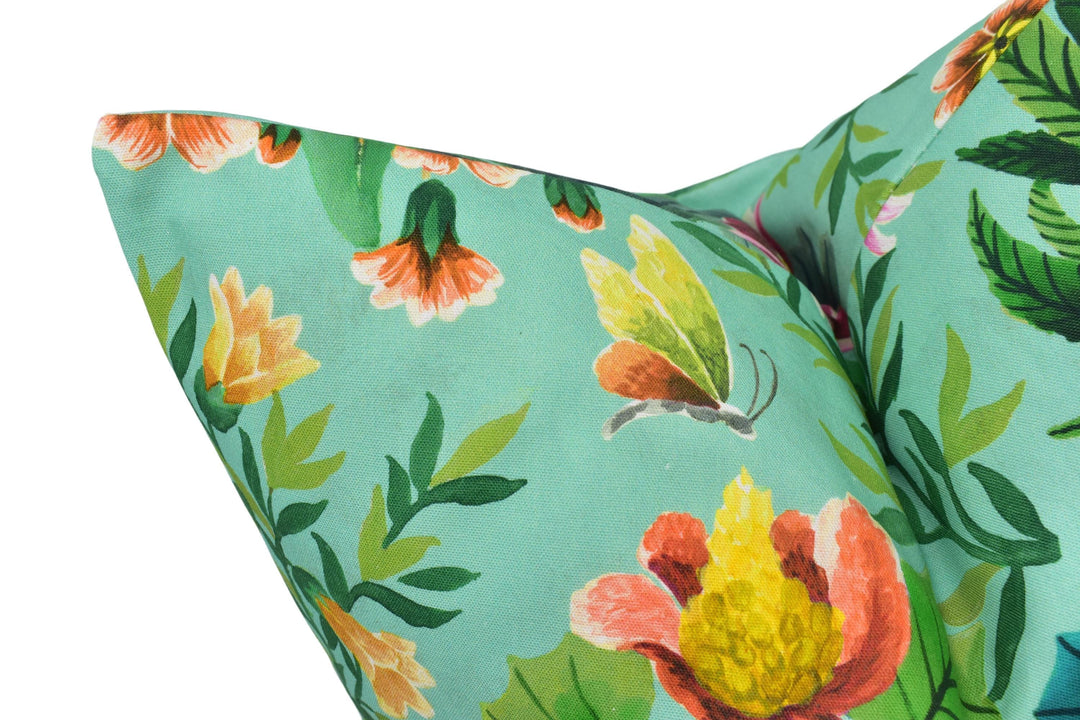 a close up of a pillow with flowers on it
