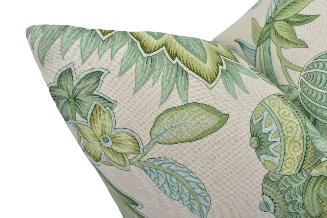 a close up of a green and white pillow