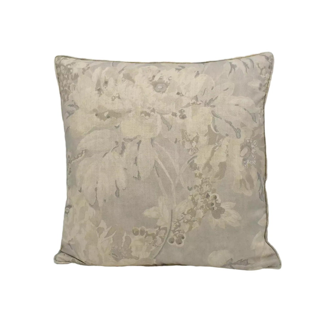 A square throw pillow with a floral print in shades of gray and beige.
