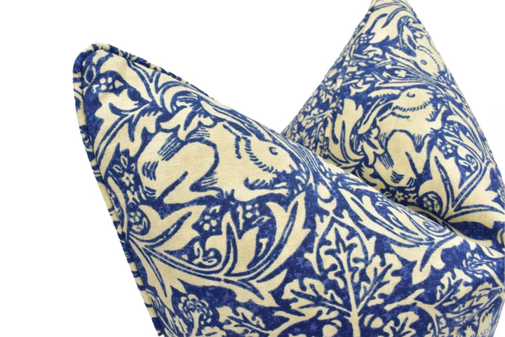 a close-up view of two decorative pillows with a blue and white floral pattern.