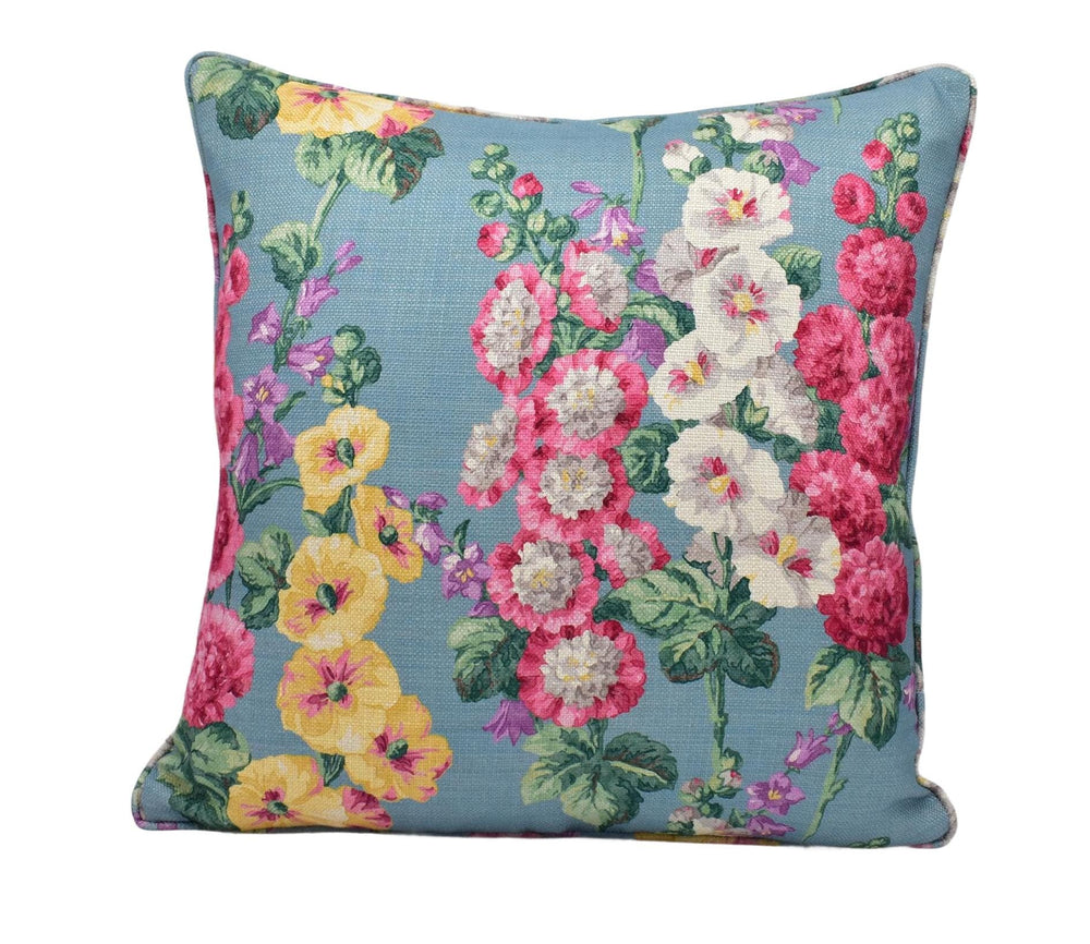 a blue pillow with colorful flowers on it