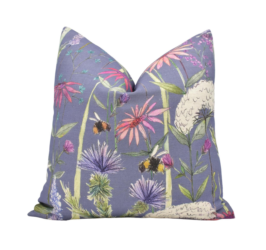 a purple pillow with flowers on it
