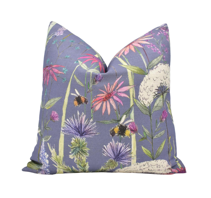 a purple pillow with flowers on it