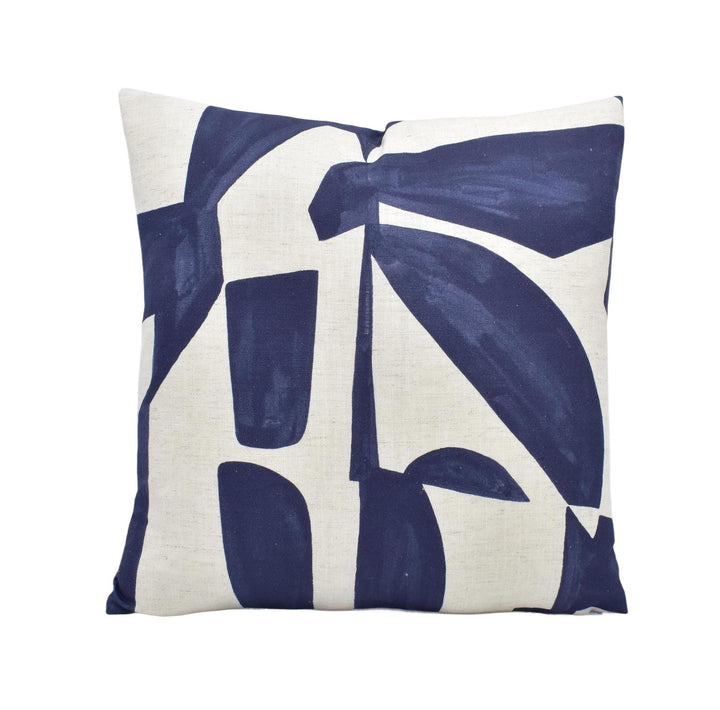 a blue and white pillow on a white background