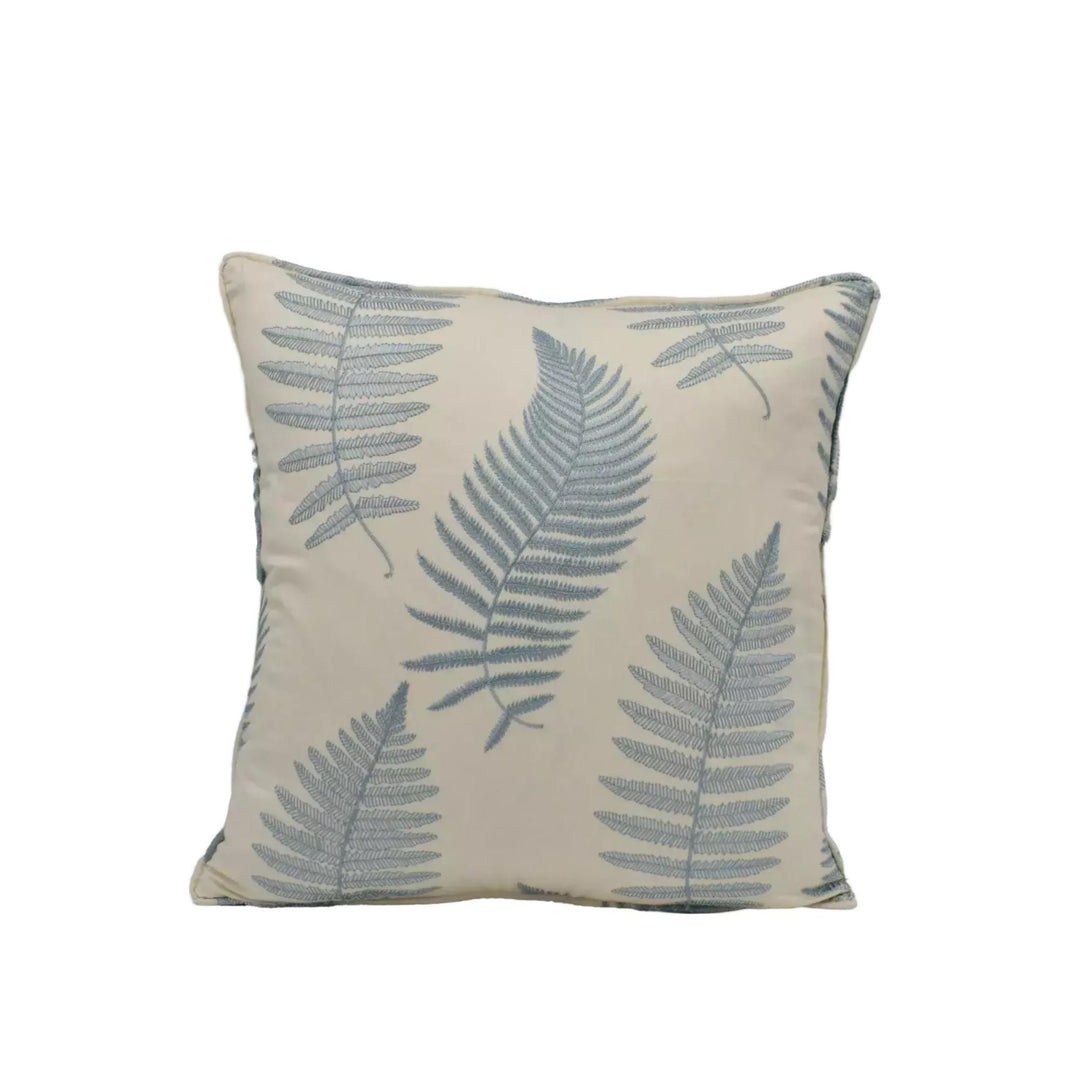 A square throw pillow with a repeating pattern of fern leaves in shades of blue and beige.