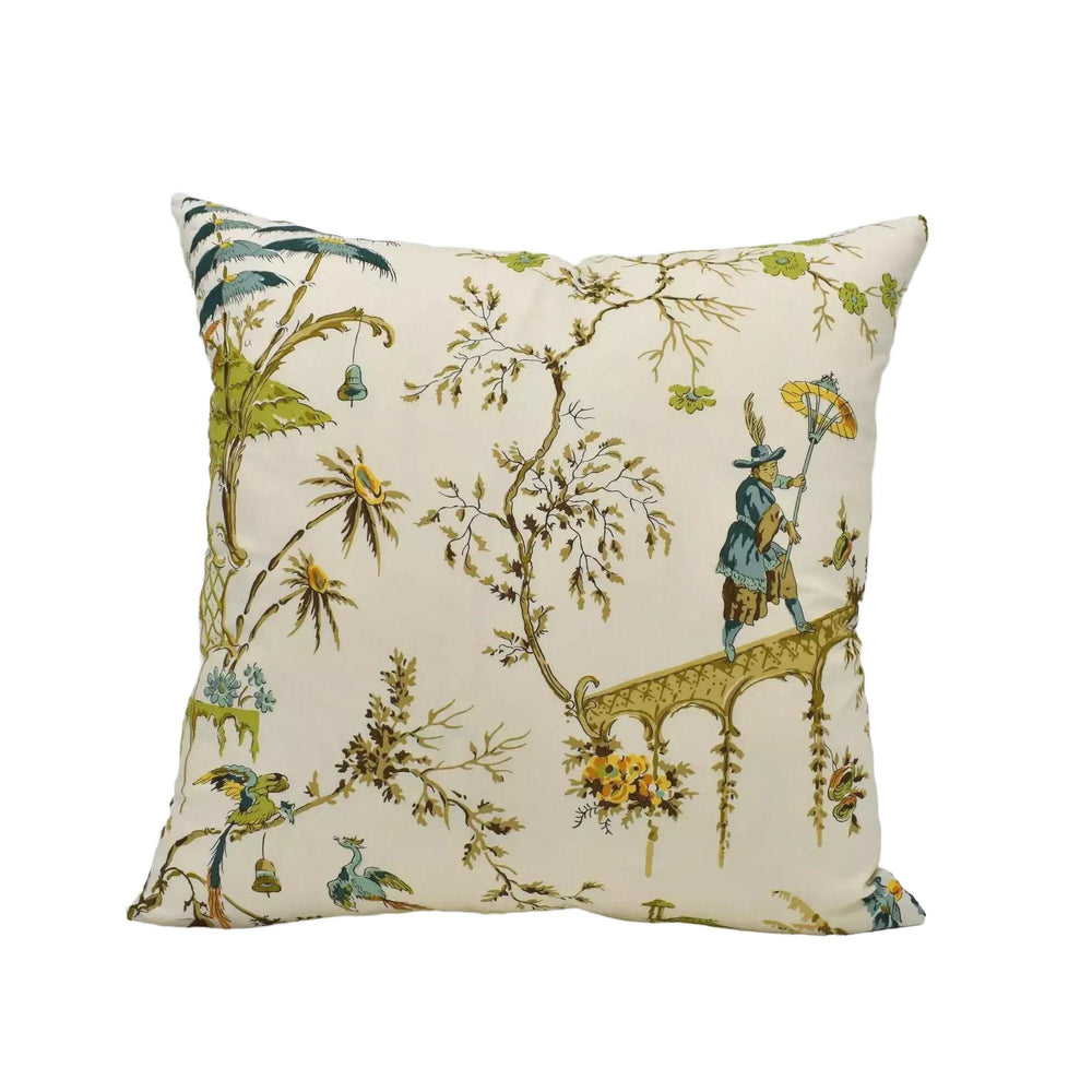 A decorative throw pillow with a floral and bird motif, featuring a person holding an umbrella and a bird in flight.