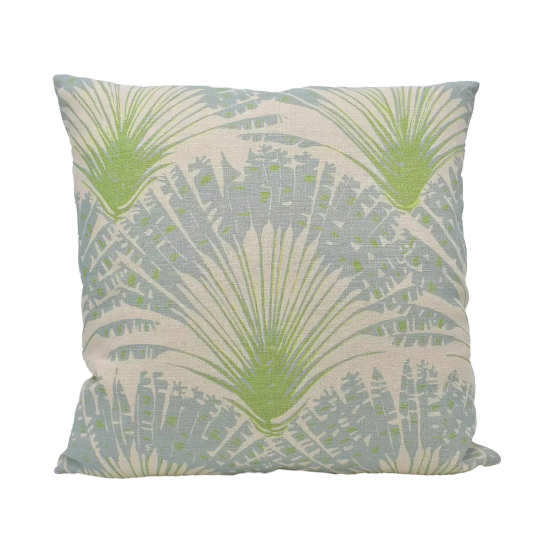 A square throw pillow with a repeating pattern of green palm leaves against a light blue background.
