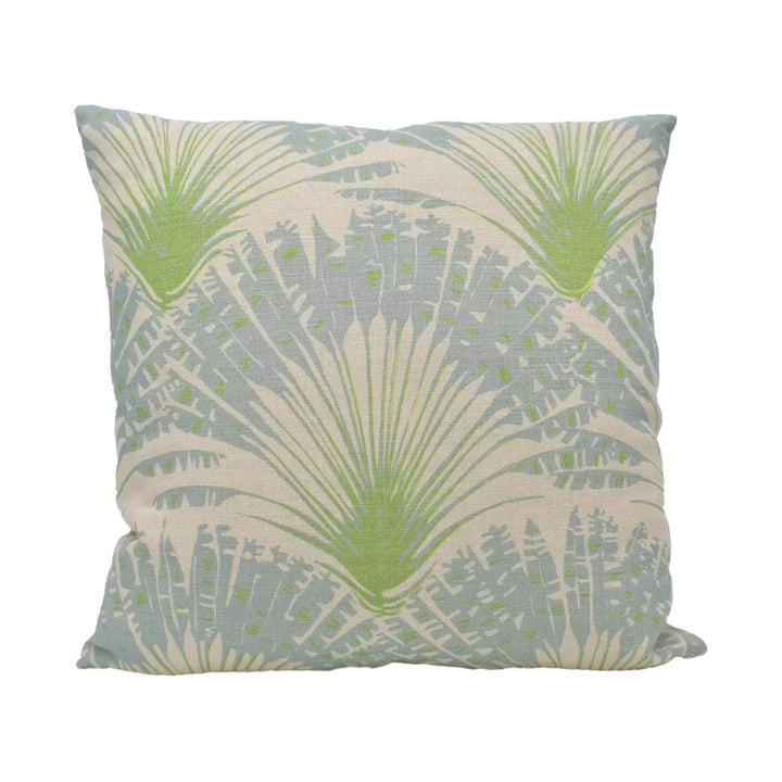 A square throw pillow with a repeating pattern of green palm leaves against a light blue background.