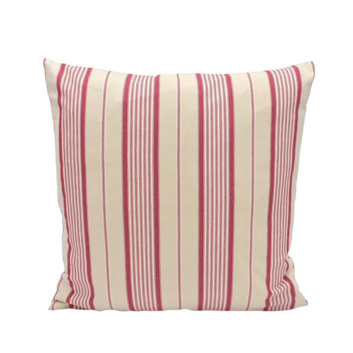 A square throw pillow with a striped pattern in red and cream colors, placed against a white background.
