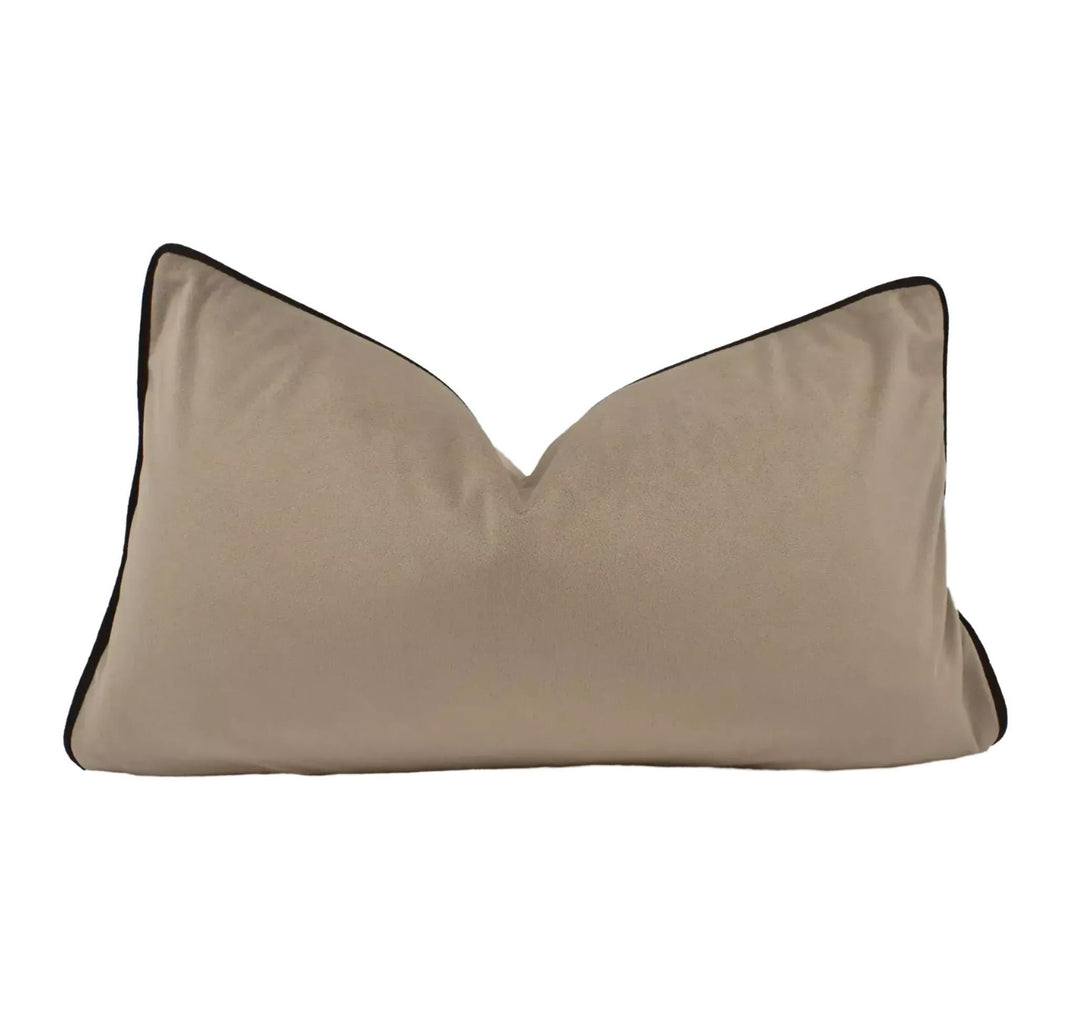 A beige pillow with a brown border is shown against a white background.