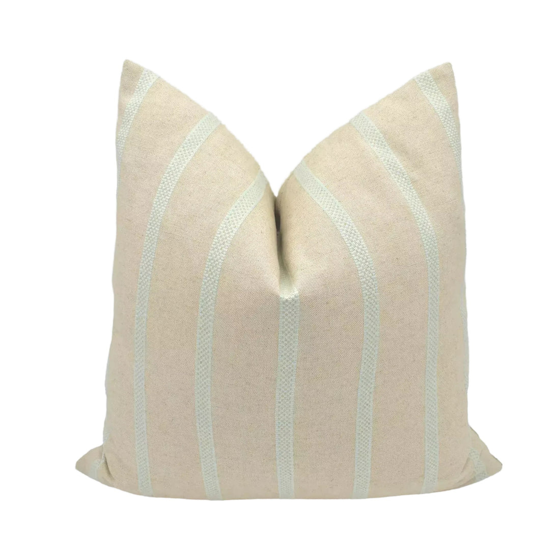 A beige pillow with green stripes is displayed against a white background.
