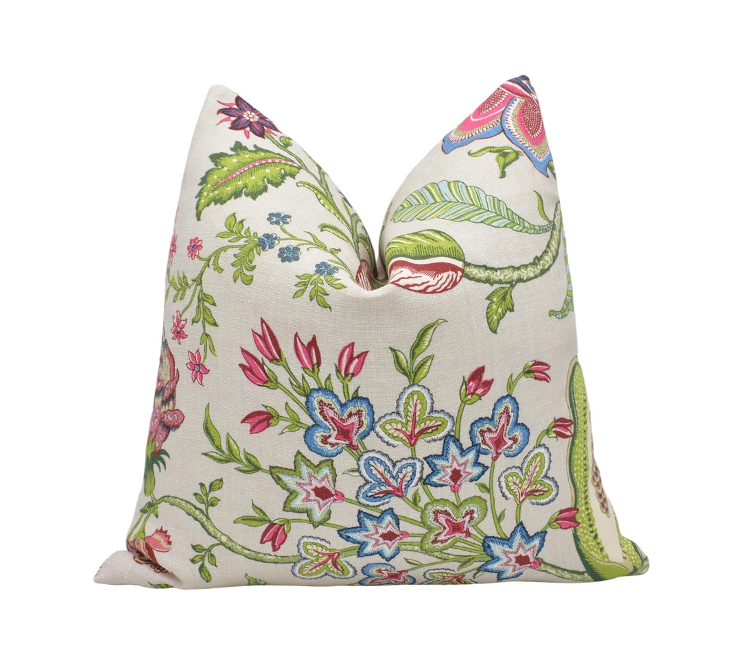 a white pillow with a floral design on it