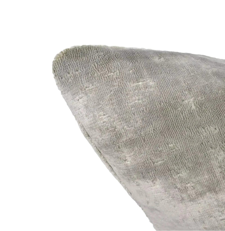 a close-up view of a textured gray fabric, possibly a piece of clothing or a textile.