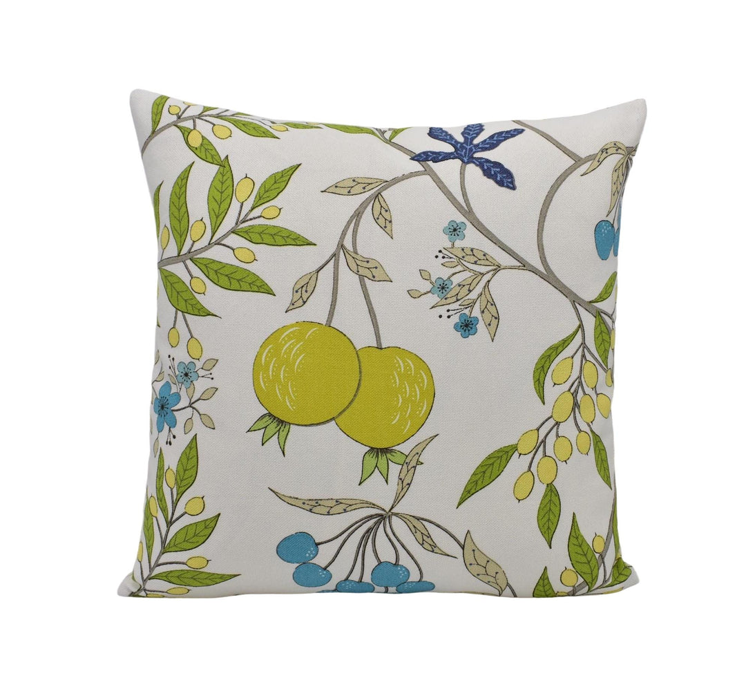A square throw pillow with a floral pattern featuring yellow fruits, leaves, and flowers in various shades of green and blue.