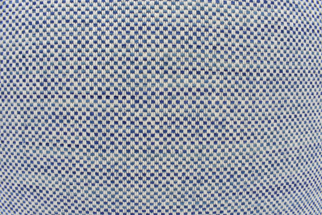a close-up view of a fabric with a checkered pattern in shades of blue and white.