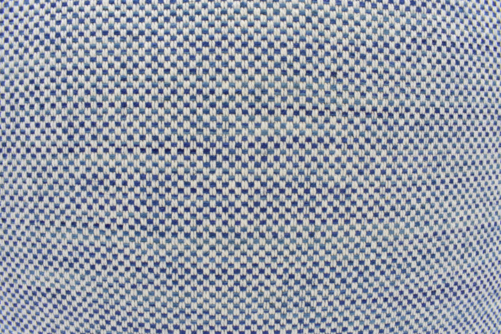 a close-up view of a fabric with a checkered pattern in shades of blue and white.
