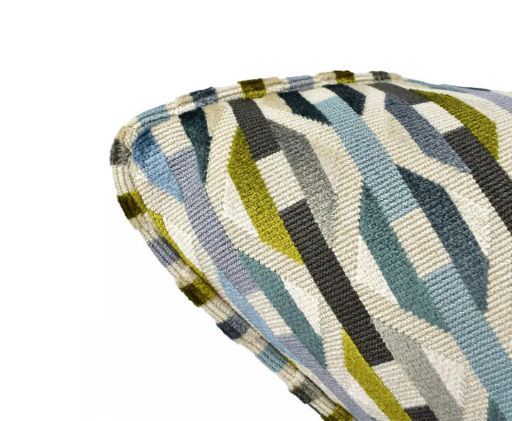 a close-up view of a colorful, geometric-patterned fabric or textile, with a mix of blue, green, and gray colors.