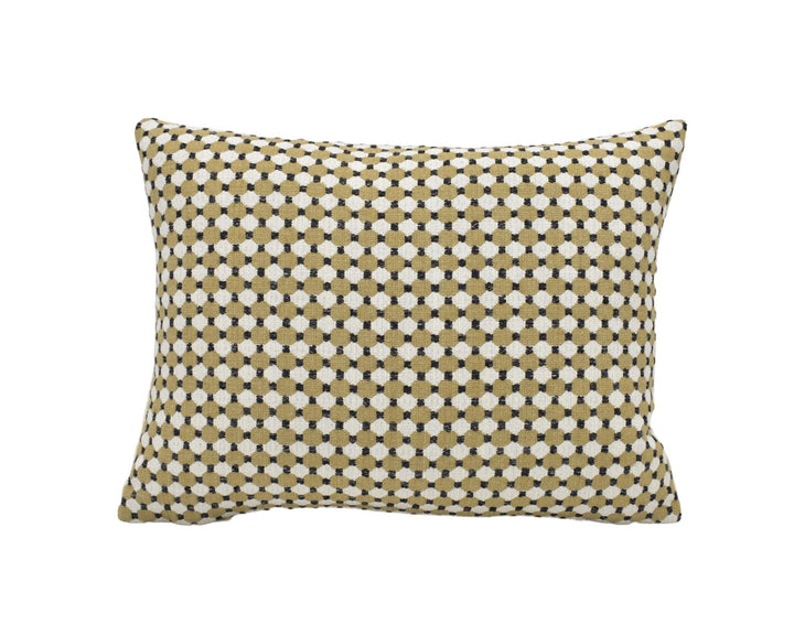 A square throw pillow with a geometric pattern of small white and beige dots.