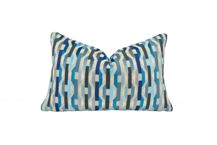 A decorative pillow with a blue and white striped pattern.