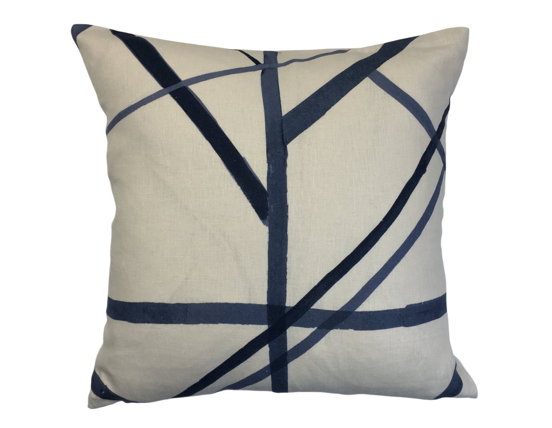 a white and blue pillow with lines on it