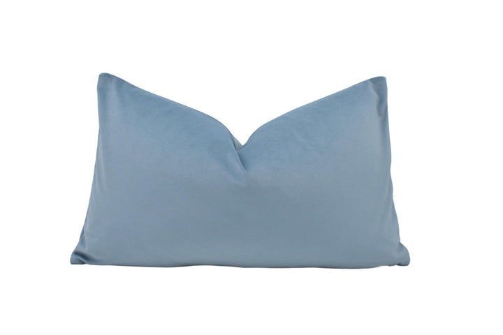 a blue pillow on a white background
