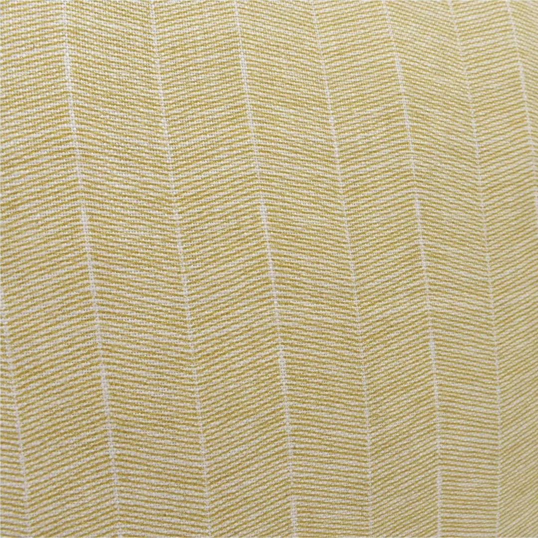 a close-up view of a fabric with a herringbone pattern, featuring a diagonal arrangement of lines that create a textured appearance.