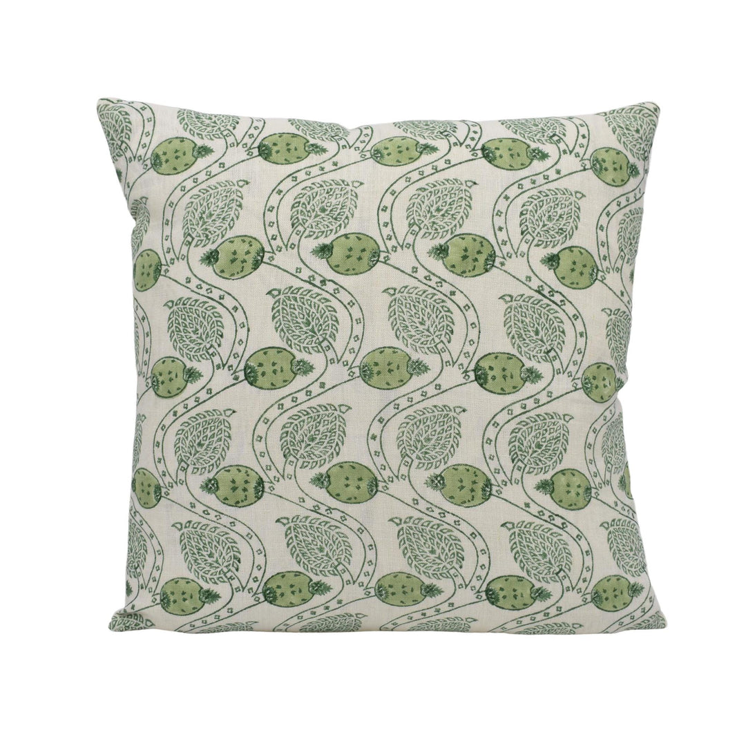 a green and white pillow on a white background