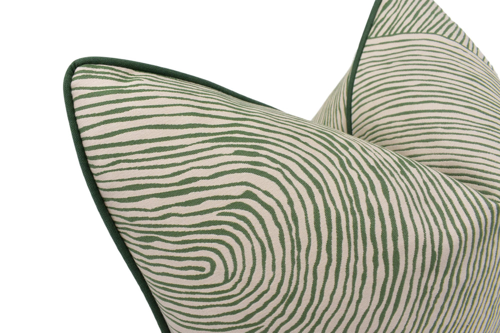 a green and white zebra print pillow on a white background