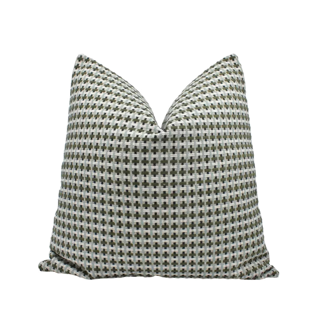 A single pillow with a checkered pattern in shades of gray and white.