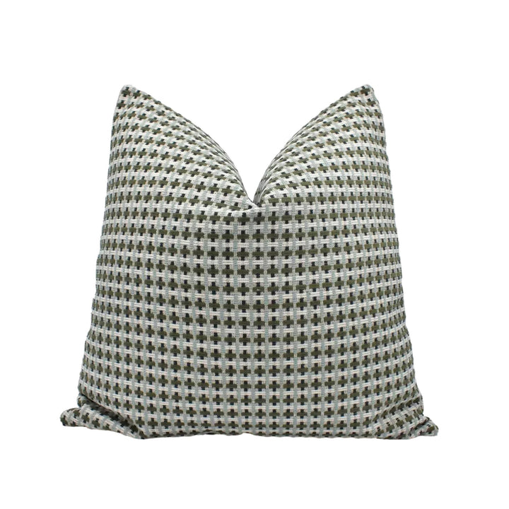 A single pillow with a checkered pattern in shades of gray and white.