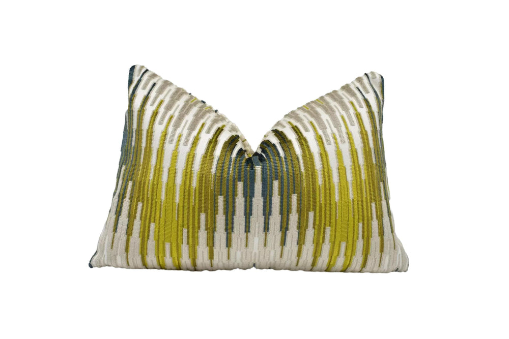 a decorative pillow with a striped pattern in shades of green and white.
