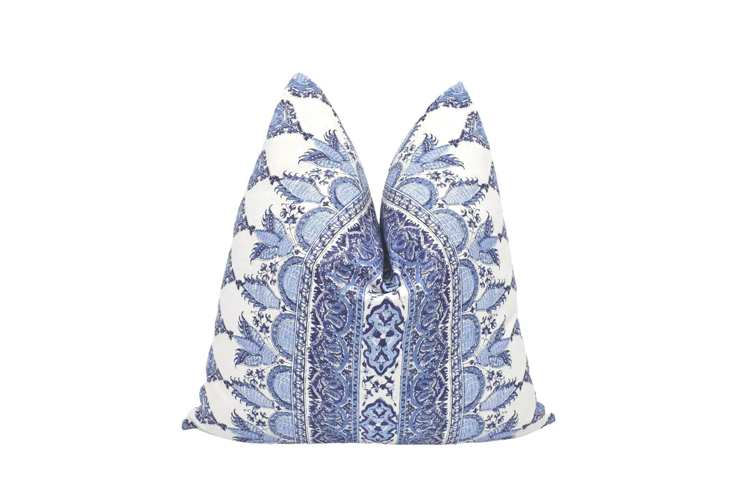 a decorative pillow with a blue and white floral pattern.