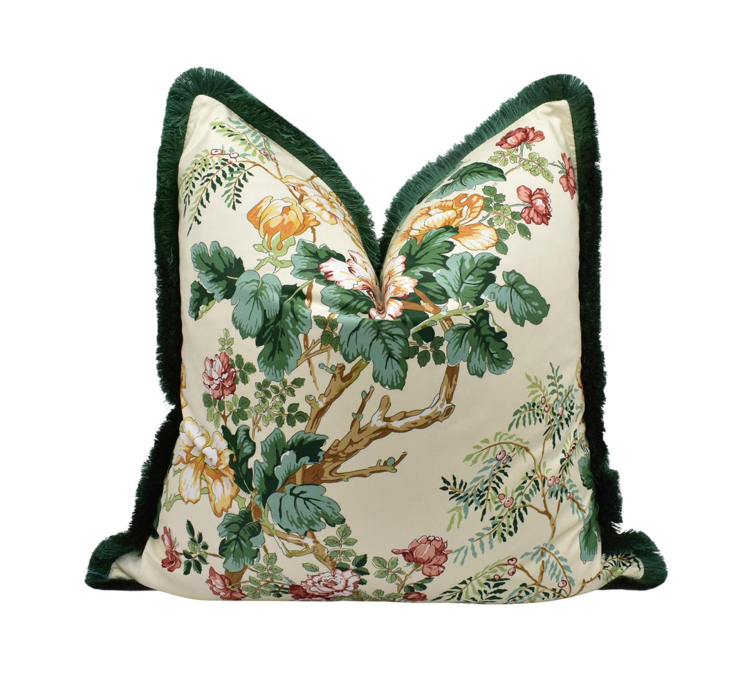 A decorative throw pillow with a floral print design on a cream-colored background.