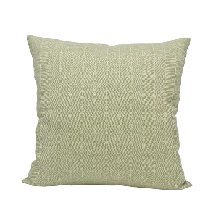 A square throw pillow with a herringbone pattern in a light green color.
