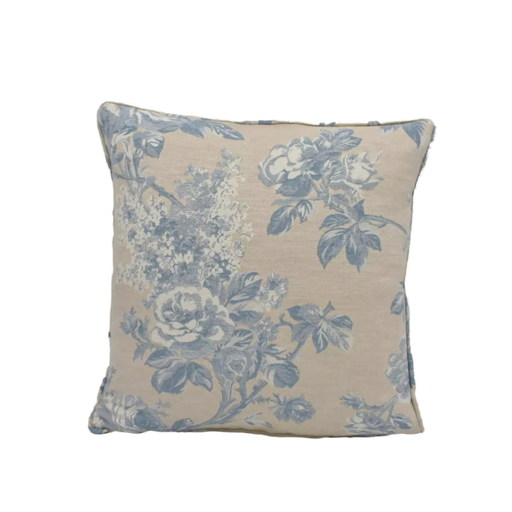 A square throw pillow with a floral print in shades of blue and white.