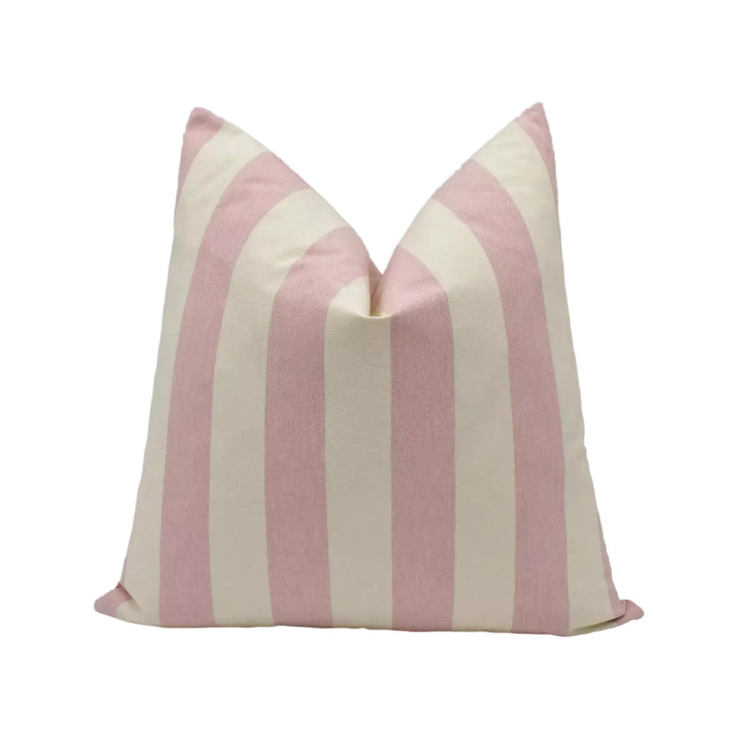A single pillow with a striped pattern in shades of pink and cream.