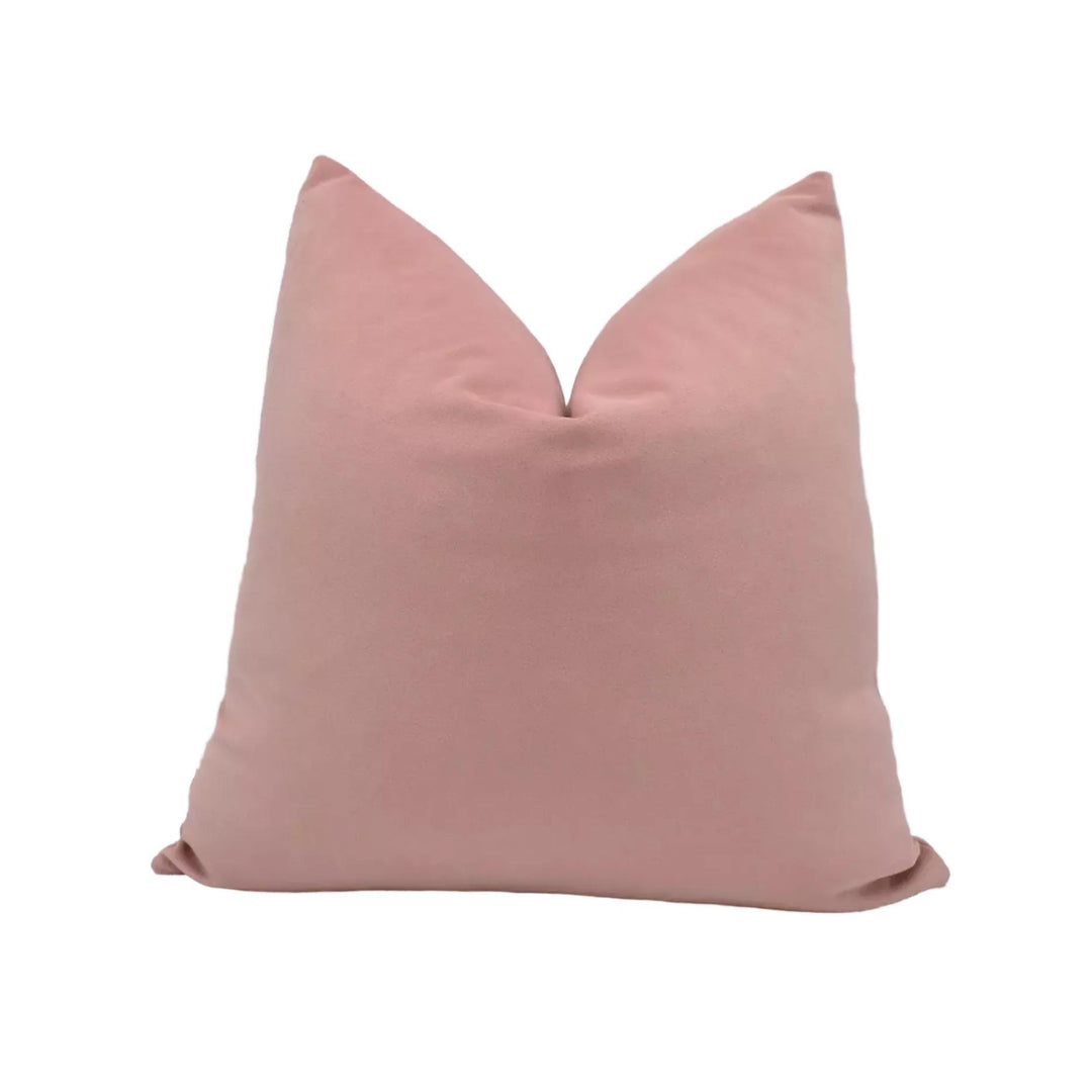 A single, solid pink pillow is shown against a white background.