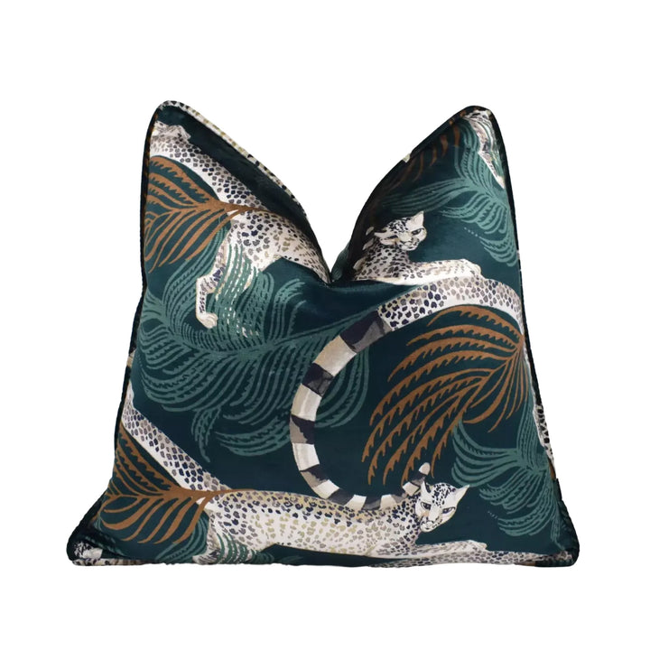 A decorative throw pillow with a leopard print design in shades of green, black, and brown.