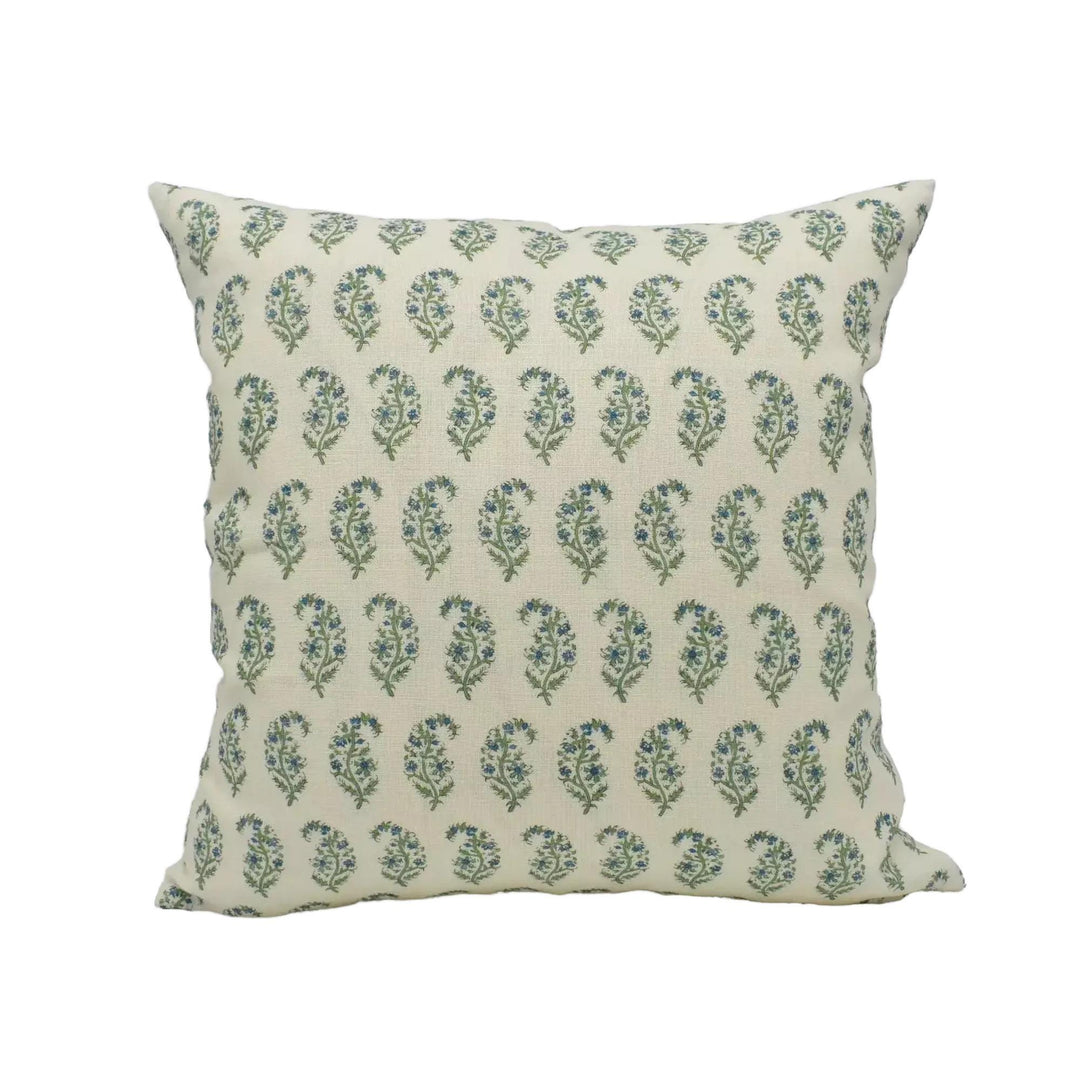 A square throw pillow with a repeating pattern of green and white paisley designs.