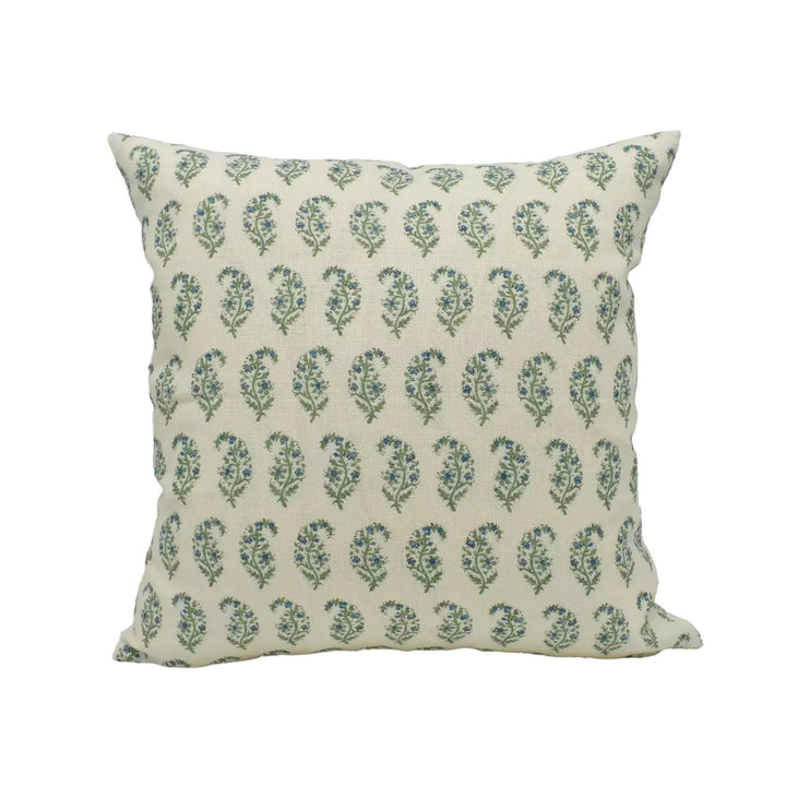 A square throw pillow with a repeating pattern of green and white paisley designs.