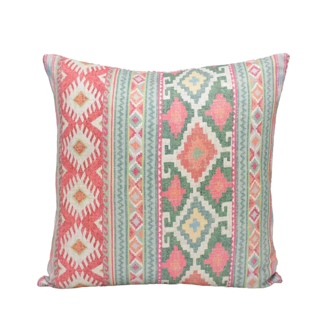 A square throw pillow with a vibrant, colorful geometric pattern in shades of pink, green, and white.