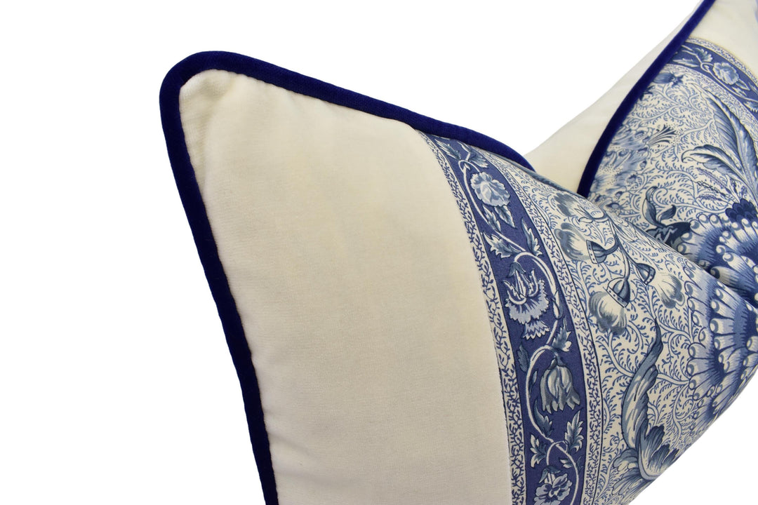 A close-up view of a decorative pillow with a blue and white floral pattern.