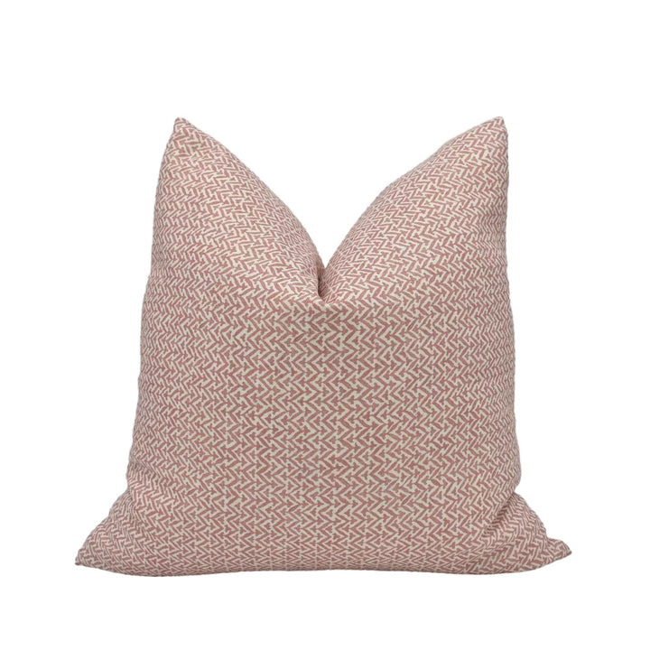 A single pillow with a pink and white zigzag pattern.