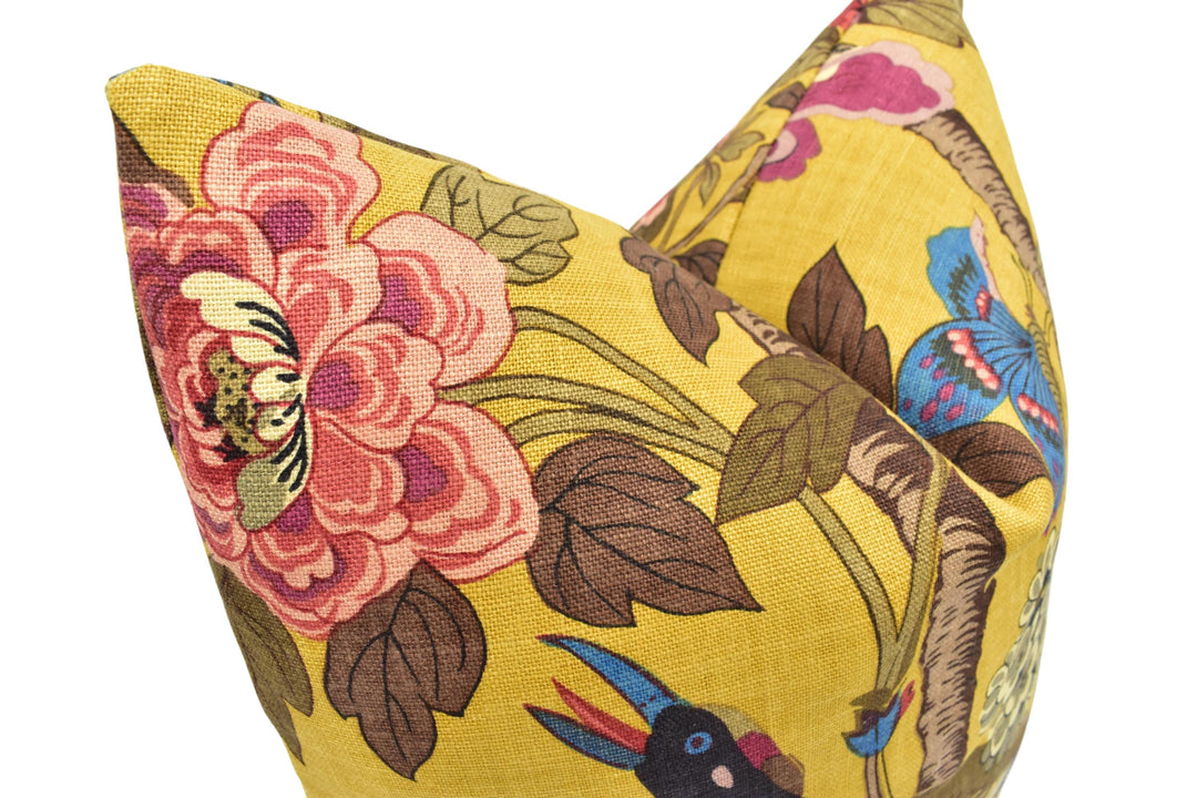 a close up of a pillow with a flower pattern on it